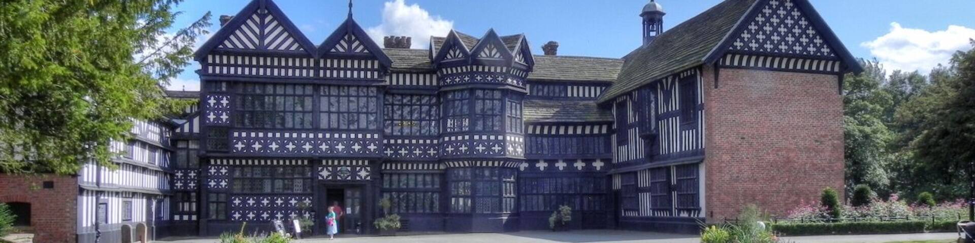 Bramall Hall viewed from the west, showing the main entrance, the courtyard and the north and south wings. The Great Hall is in the centre.