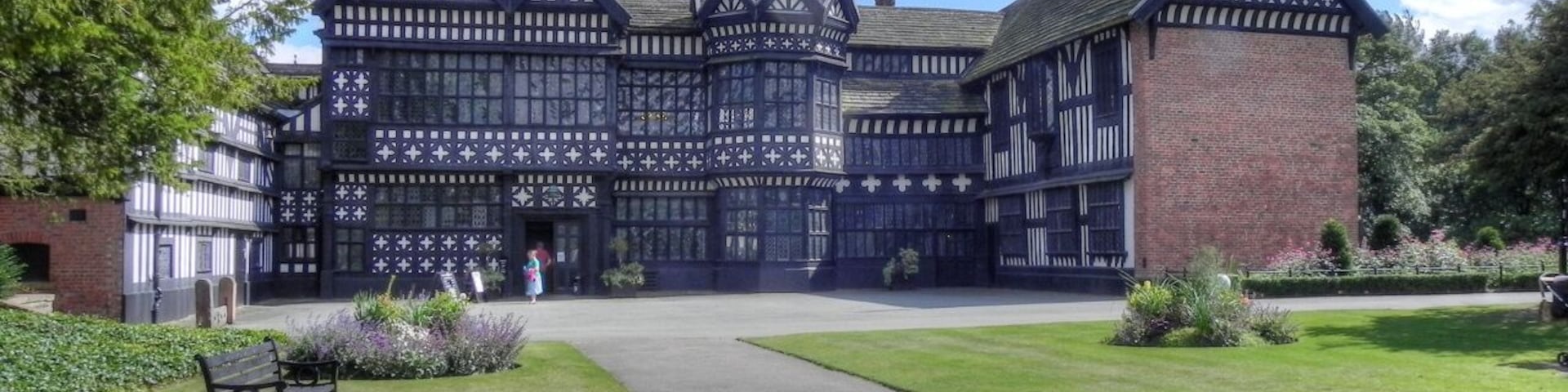 Bramall Hall viewed from the west, showing the main entrance, the courtyard and the north and south wings. The Great Hall is in the centre.
