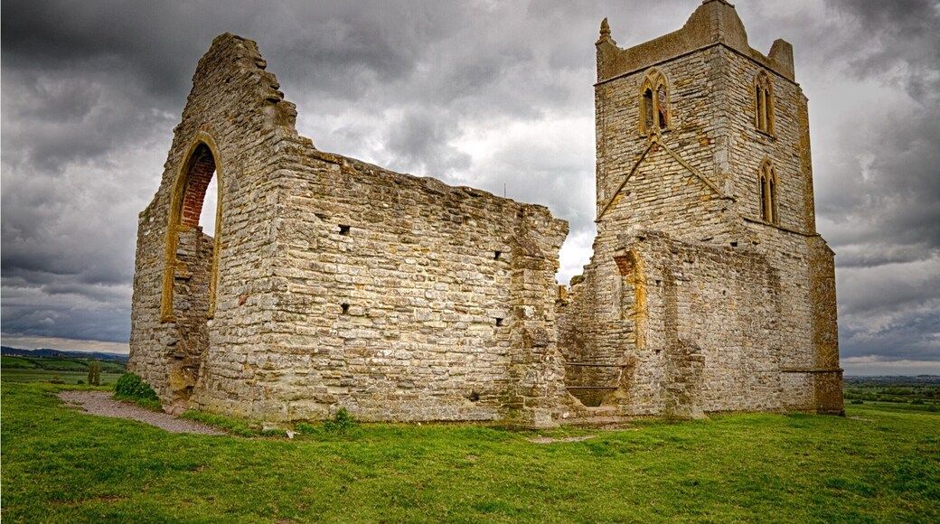 Burrow Mump is a hill and historic site overlooking Southlake Moor in the village of Burrowbridge within the English county of Somerset. It is a scheduled monument, with the ruined church on top of the hill a Grade II listed building. Wikipedia