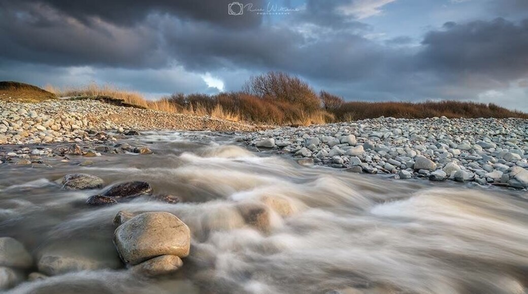 The river from kilve flowing out to sea after all the recent snowfall