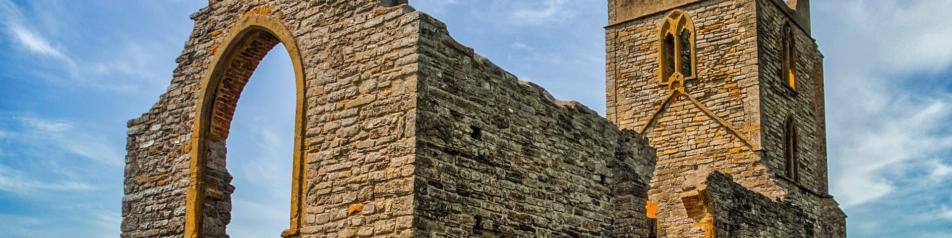 Burrow Mump is a hill and historic site overlooking Southlake Moor in the village of Burrowbridge within the English county of Somerset. It is a scheduled monument, with the ruined church on top of the hill a Grade II listed building.
