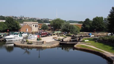 scenic view of brighouse basin with boats and moorings and the lock gates to the calder and hebble navigation canal in west yorkshire
