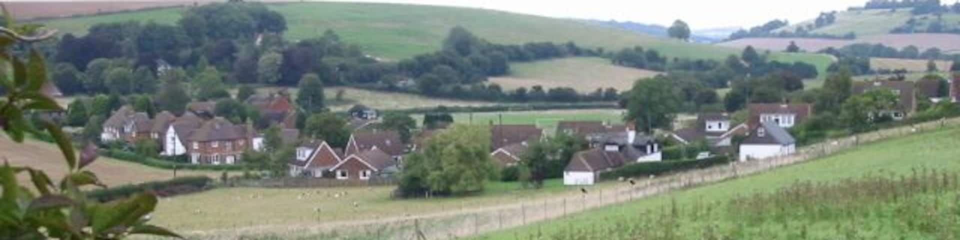 Looking NE towards housing at the north of Elham The houses are on Fairfield and Park Lane.