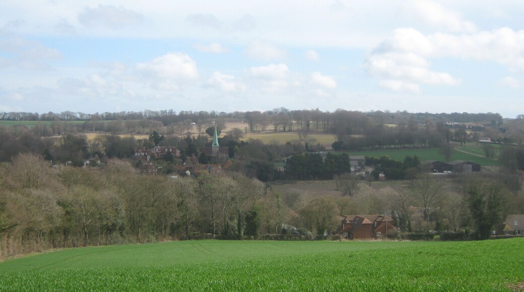View of Barham Seen from Greenhills, near Greenhills Farm. Behind the Barham Church spire, a few cars on the A2 Dual carriageway can just be seen in the background.