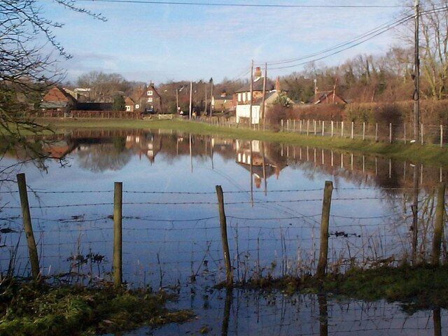 Nailbourne in flood The former school in Bekesbourne on right and Parsonage Farm reflected in flood water.