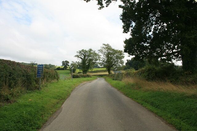 Single track road with passing places Leading away from Wyck Rissington. Further along this becomes a 1 in 10 climb.