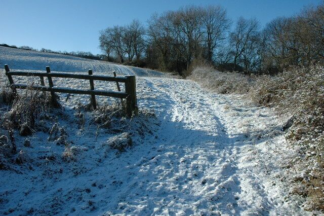 Field entrance on Langley Hill A light snowfall covers the land on Langley Hill.