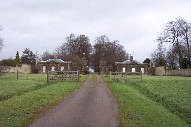 Gatehouses by the entrance to Sherborne Park A fine symmetrical view from the A40.