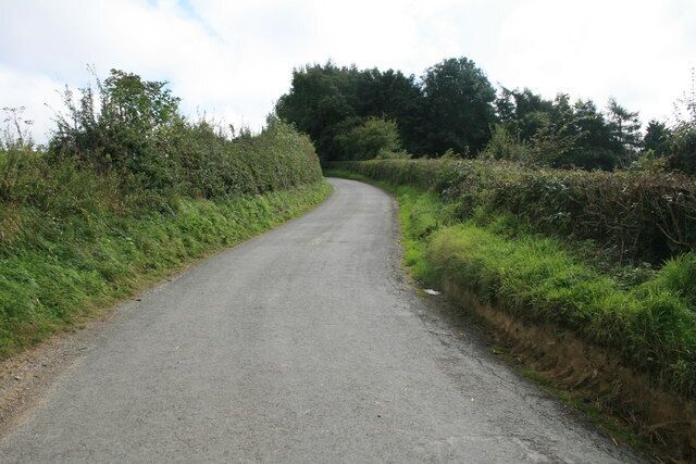 Uphill and round a bend Heading away from Wyck Rissington.