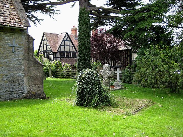 Churchyard, Staverton With timbered house behind.