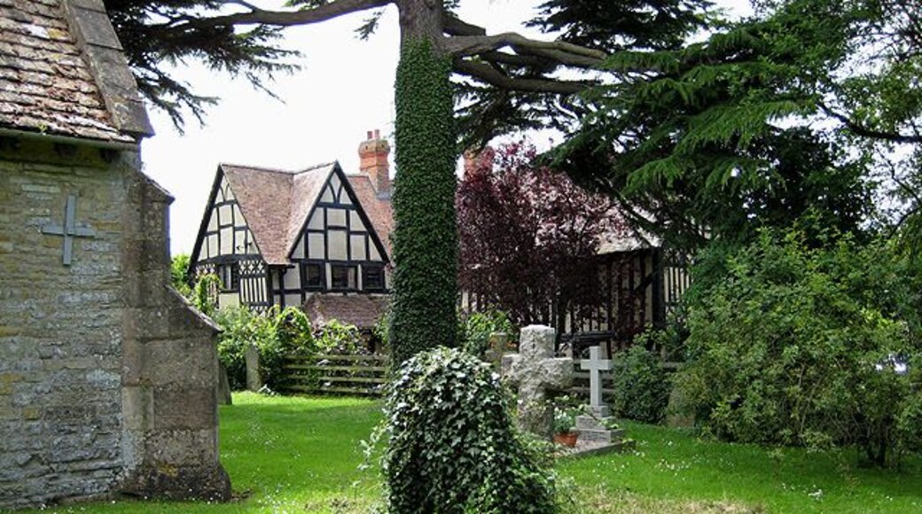 Churchyard, Staverton With timbered house behind.