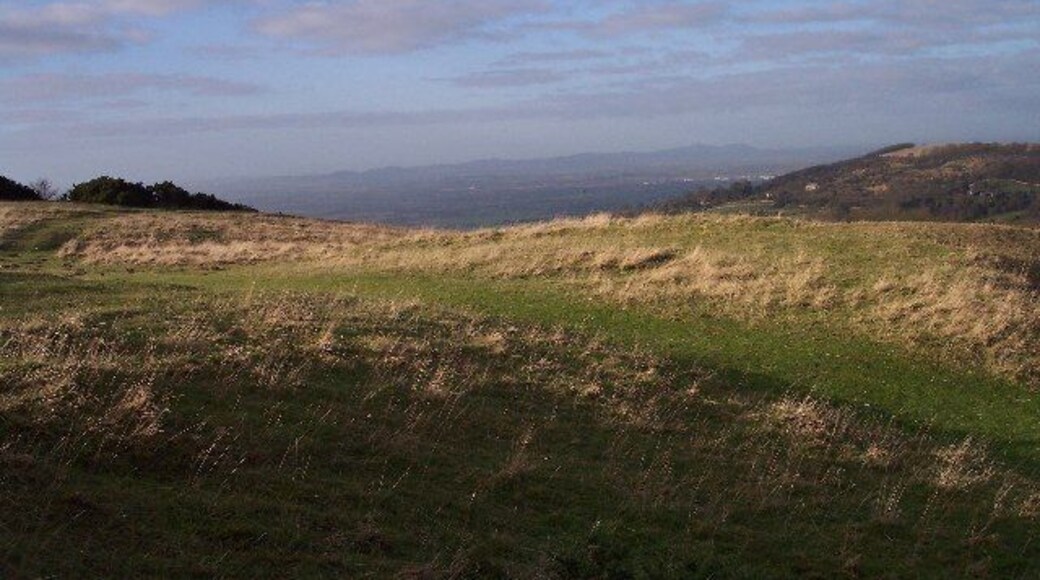 View of the Malvern Hills from Cleeve Hill. Looking WNW across the Severn Plain to the Malvern Hills on the horizon.
