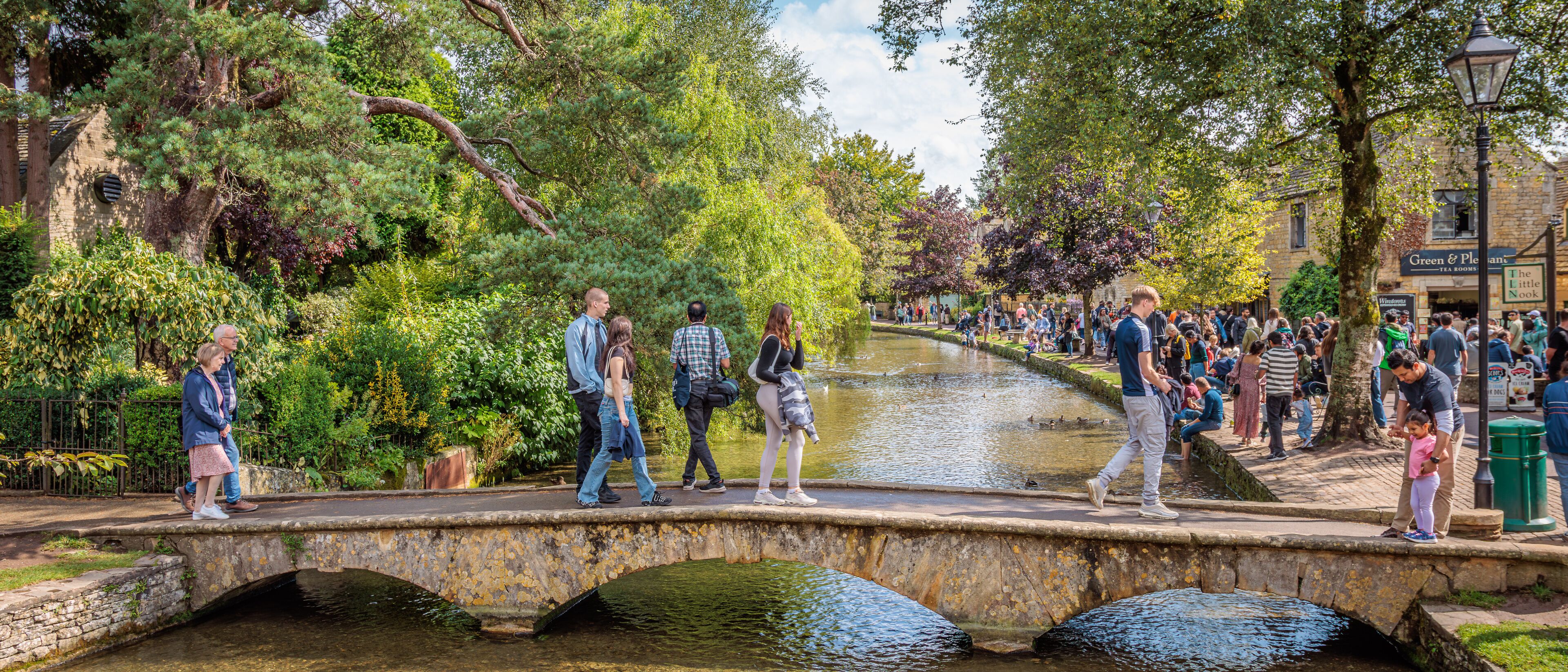 Bourton-on-the-Water, England - August 24 2024 "Honey coloured stone architecture idyllic village"