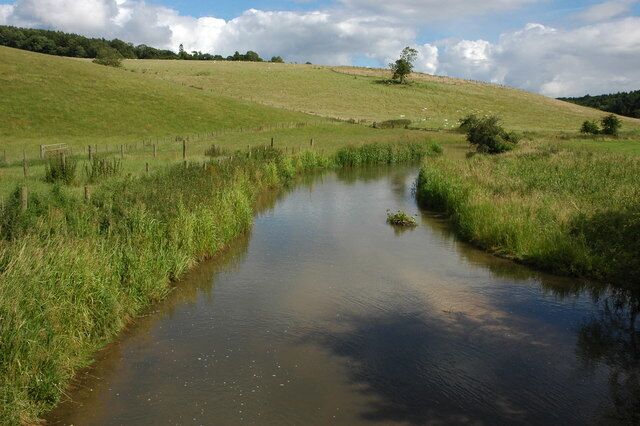 The River Coln at Cassey Compton. The river appears to have been cleaned out since previous Geograph pictures were taken. See: 53345 293941