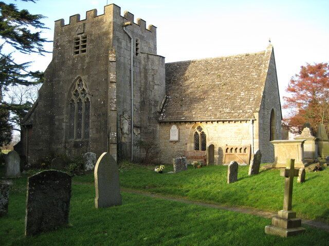 A historic church with a tower and a graveyard.