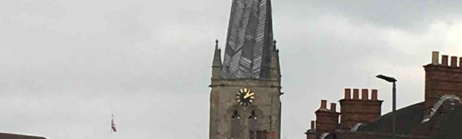 The famous crooked spire at Chesterfield. The spire caught fire, unseasoned wood was used after the fire to reconstruct along with 32 tons of lead, as the wood dried out the weight of the lead twisted the spire.