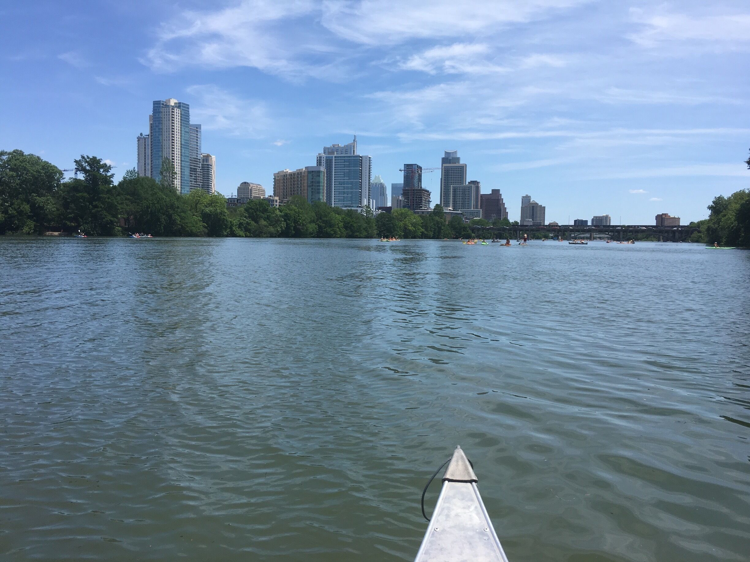 Canoeing along lady bird lake viewing Austin's skyline at Zilker Park. 