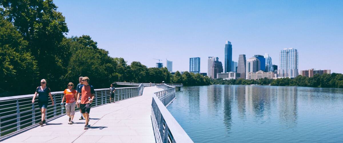 #TakeAHike along Austin's Hike and Bike Trail on a boardwalk east of Congress Ave (and downtown) to enjoy beautiful views on the city skyline. From downtown do ~3 mile loop between Congress Ave and I-35 bridges. Pictured hikers on the south side of the river boardwalk, less than a mile from Congress Ave bridge #AustinTX #ATX