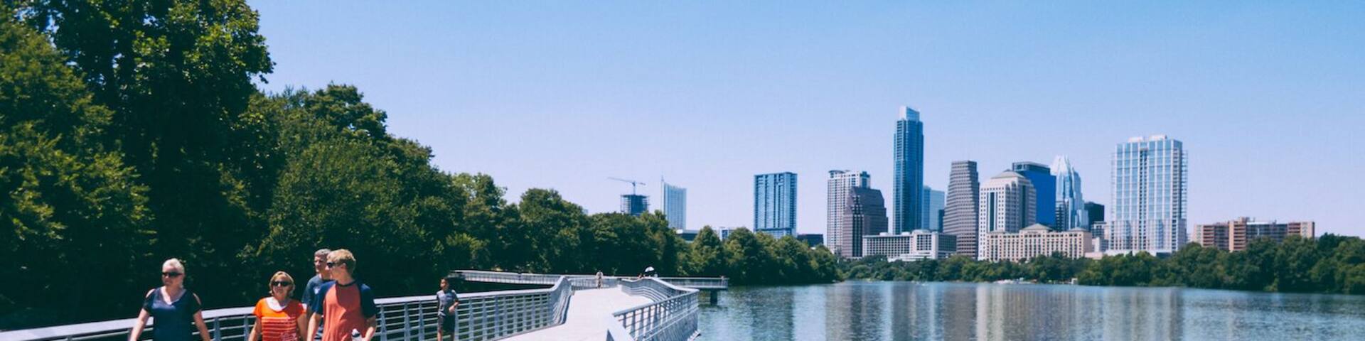 #TakeAHike along Austin's Hike and Bike Trail on a boardwalk east of Congress Ave (and downtown) to enjoy beautiful views on the city skyline. From downtown do ~3 mile loop between Congress Ave and I-35 bridges. Pictured hikers on the south side of the river boardwalk, less than a mile from Congress Ave bridge #AustinTX #ATX