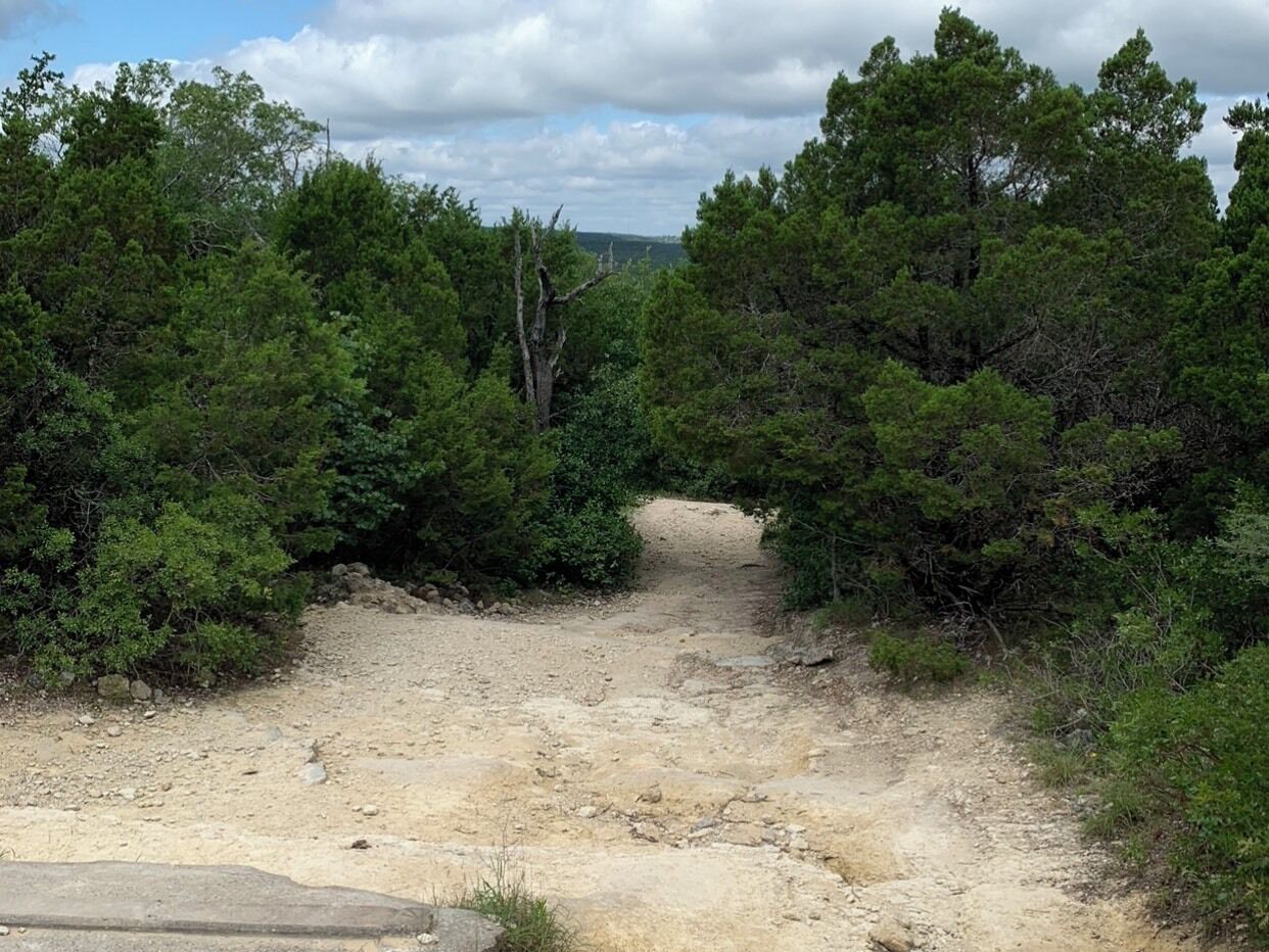 East Oak Hill in Austin TX. This lengthy, hilly, rocky path leads down to a beautiful creek