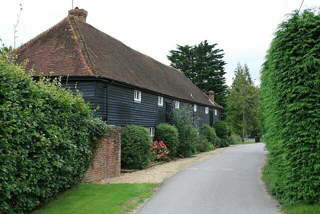 The Tithe Barn, Park Lane Situated in Park Lane, a private road (but also a public footpath) leading to Park Farm. The road is now very quiet, but the turn to the left, just after the Tithe Barn, was once a public road leading out to the Oving Road, but has been stopped up with the reservation of a public footpath.
