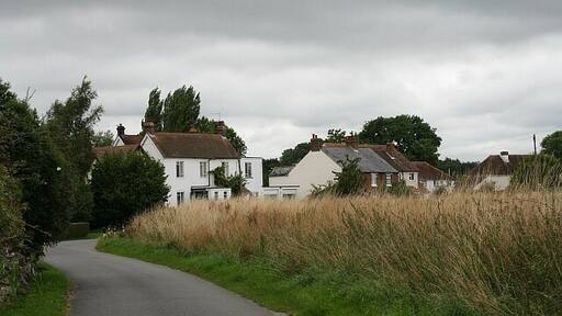 Church Road Nos. 10-20 Church Road, Aldingbourne, seen from the north entrance to the church of St Mary the Virgin.