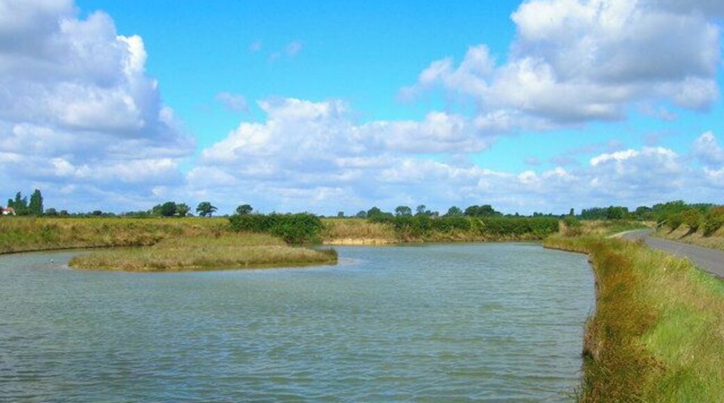 Catchwater area, Chidham Creek. Pond formed by the waters of Chidham Creek and stored here. Chidham Lane is to the right and the sea wall is visible beyond that.