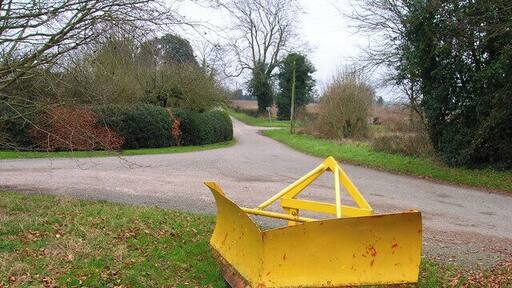 Snow Plough Left behind after the recent snows perhaps? It's stamped on the other side as belonging to West Sussex County Council and now it's been left on the eastern side of the open ground in Chilgrove village. Behind the plough is the crossroads of lanes leading away from the village.