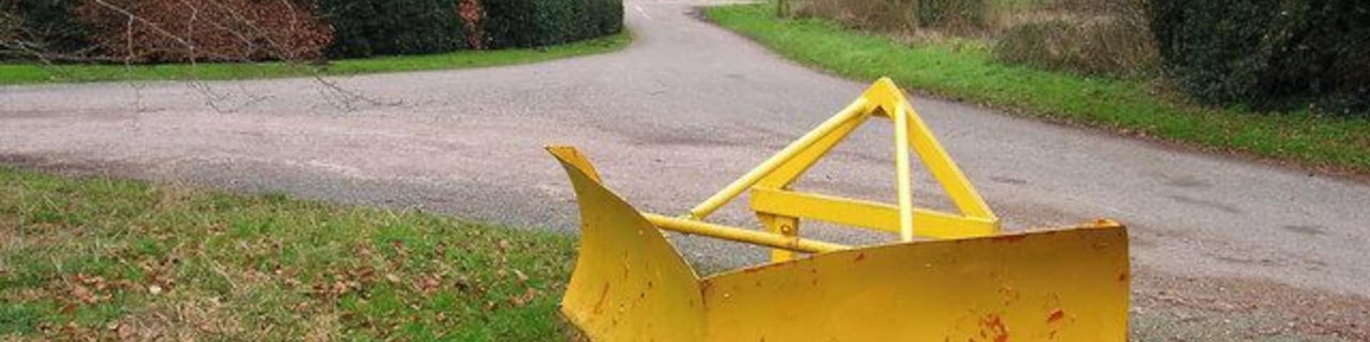 Snow Plough Left behind after the recent snows perhaps? It's stamped on the other side as belonging to West Sussex County Council and now it's been left on the eastern side of the open ground in Chilgrove village. Behind the plough is the crossroads of lanes leading away from the village.