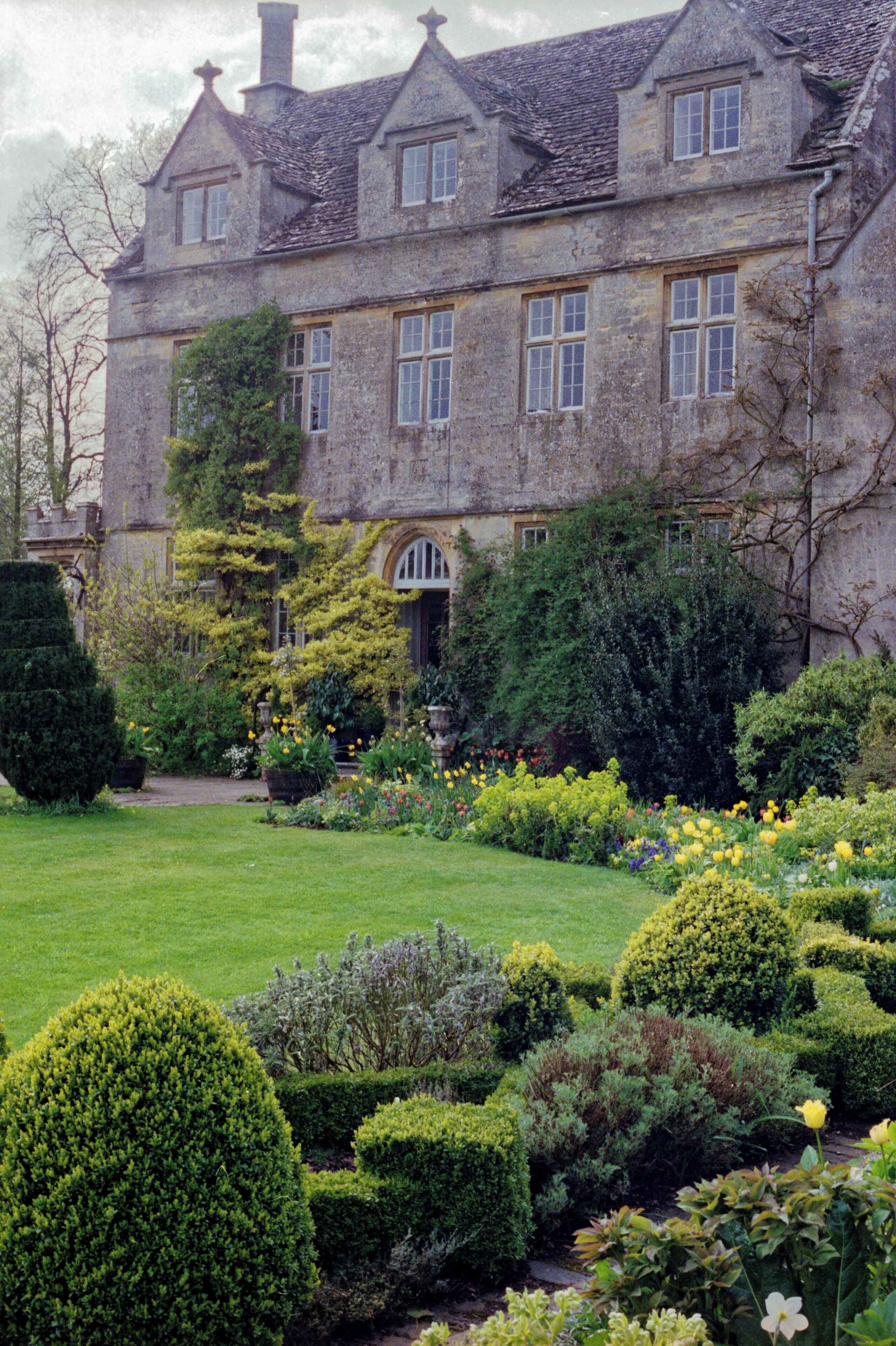 1992 Spring photograph from the gardens at the west of Barnsley House, at the time Rosemary Verey was in residence and directly caring for the garden. Processing: SLR camera Kodak Gold ASA 200-2 film negative scanned with an Epson Perfection V800 using SilverFast 8 scan program, and optimized, cropped and spun with DxO OpticsPro 10 Elite and Adobe Photoshop CS2.