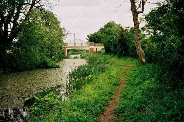 Thames & Severn Canal looking towards Spine Road Bridge The new Spine Road Bridge is in the distance. 1513941.