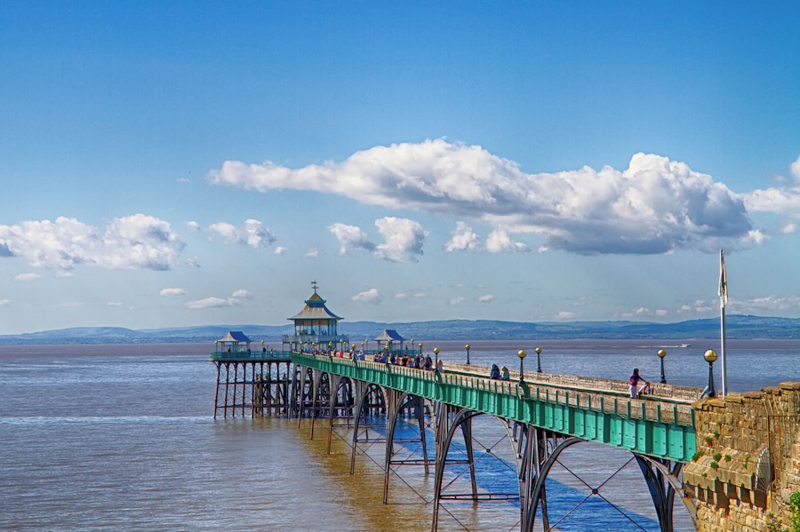 Clevedon Pier was opened in 1869 to receive paddle steamer passengers from Devon and Wales. It is a grade 2 listed building. Sir John Betjerman said it was "the most beautiful pier in England"