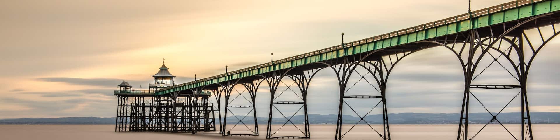 Beautiful shot of the Clevedon Pier in England under the breathtaking colorful sky