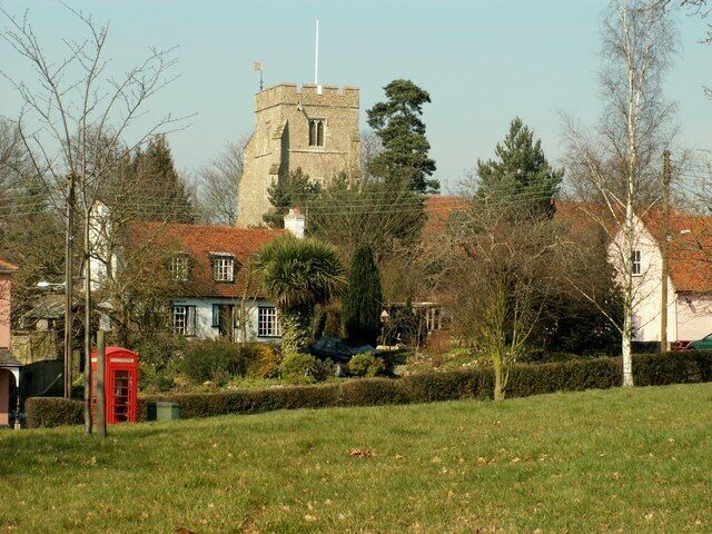 Feering, Essex. The fine 15th century tower of All Saints church stands proud above its charming village.