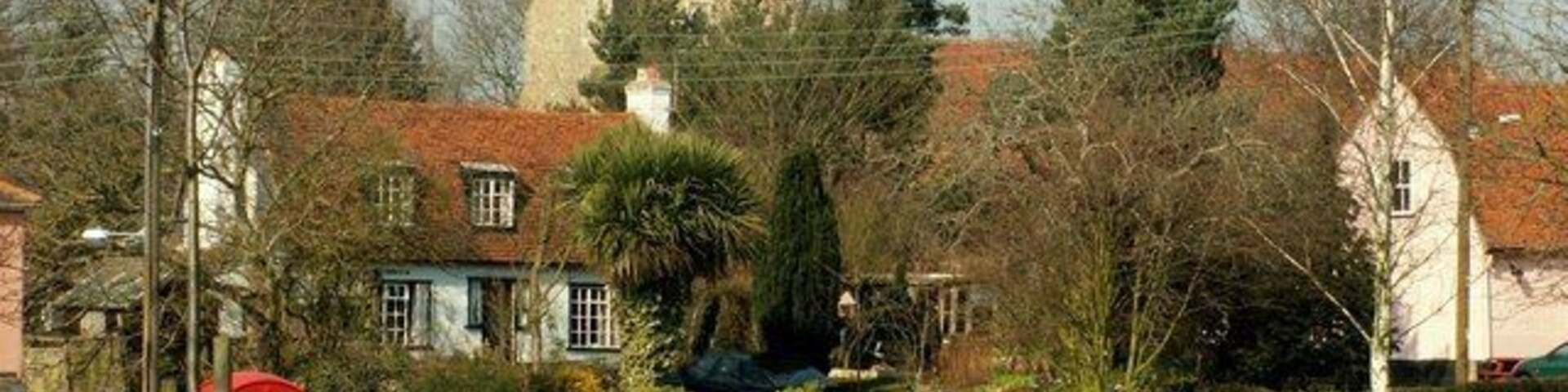 Feering, Essex. The fine 15th century tower of All Saints church stands proud above its charming village.