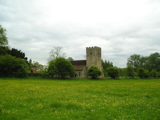 View south across a field at Higham, Suffolk, to St Mary's parish church