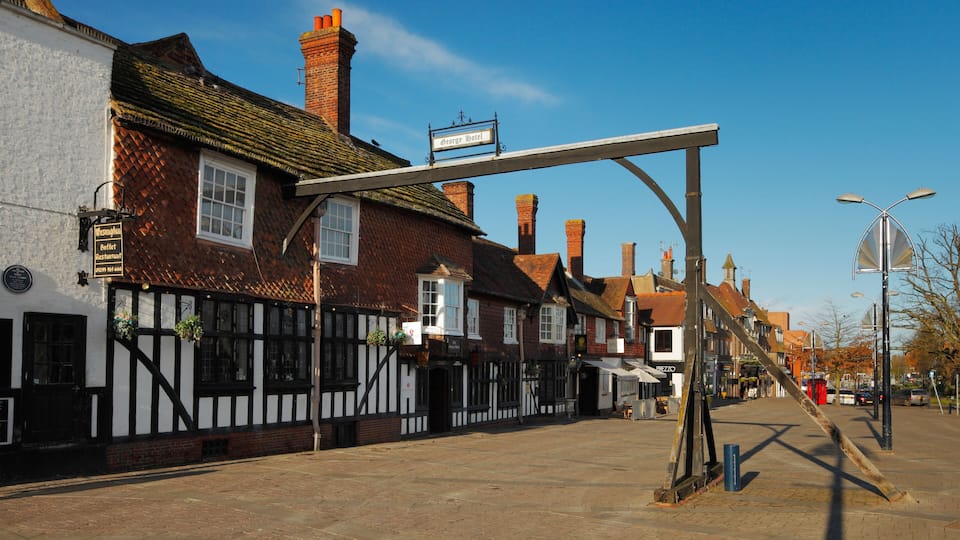 A traditional half-timbered building with a sign for 'George Hotel'.