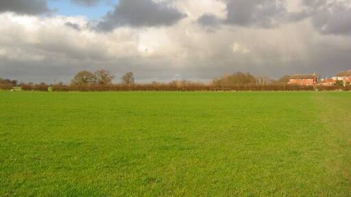 Storm clouds west of Wistaston Flat pasture to the west of Wistaston, with mature trees in the field boundaries. The housing estate (right) is part of the Marys Gate estate which straddles this gridsquare and SJ6853 (see 350704). View north east from the path between Wistaston School and Colleys Lane, near Church House Farm