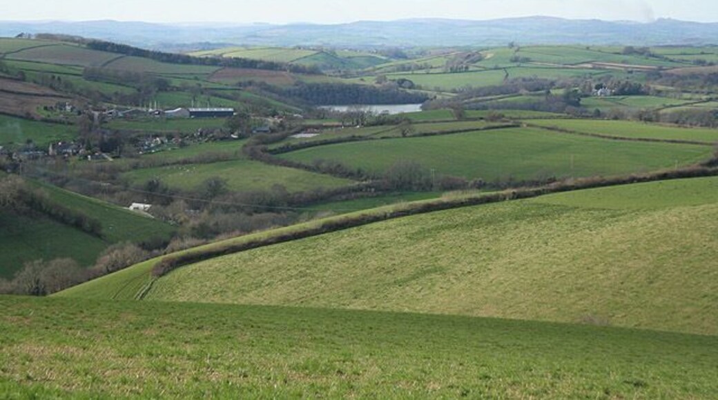 Dittisham: towards East Cornworthy In the distance, beyond the square, Bow Creek is hidden to the left of a bend in the river Dart. Dartmoor provides the horizon and a plume of smoke to the right, just distinguishable from cloud, indicates that swayling is in progress
