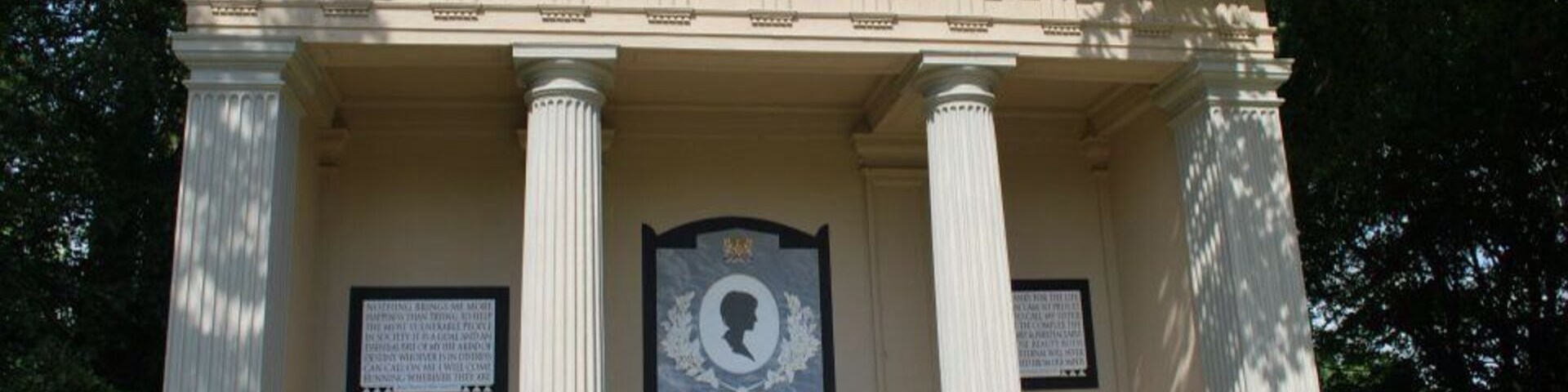 A neoclassical monument with the name 'DIANA' and dates '1961' and '1997'.