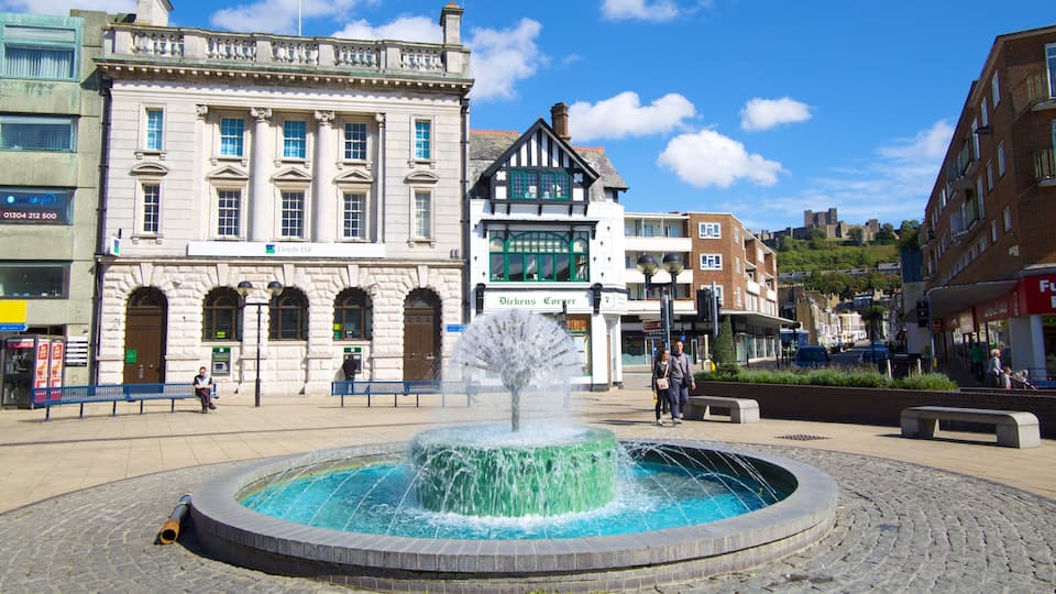 A fountain in a square with historic buildings, including Lloyds TSB and Dickens Corser.