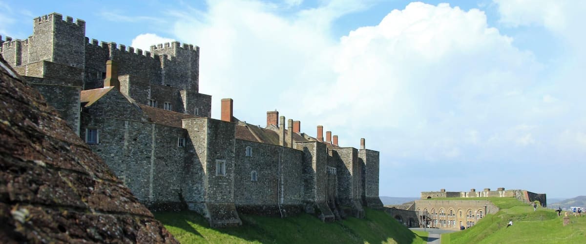 For a great family day out in Kent visit Dover Castle, open all year round. Immerse yourself in our dramatic new visitor experience, Operation Dynamo: Rescue from Dunkirk, open now to visitors. Spectacularly situated above the White Cliffs of Dover this magnificent castle has guarded our shores from invasion for 20 centuries - now you can enjoy a great family day out with a visit to the 'Key to England'. Explore the darkly atmospheric Secret Wartime Tunnels now with a vivid recreation of the Dunkirk evacuation, complete with dramatic projections of swooping Spitfires and real film footage. Watch Heart FM's breakfast team James & Charlie as they experience Operation Dynamo. Enjoy a colourful contrast with the richly-furnished Great Tower, where costumed actors introduce medieval life at King Henry II's court. With exciting exhibitions, winding tunnels to explore, ghosts to hunt out - and of course restaurants, shops and the space for youngsters to run around - an action-packed, great value day out awaits!