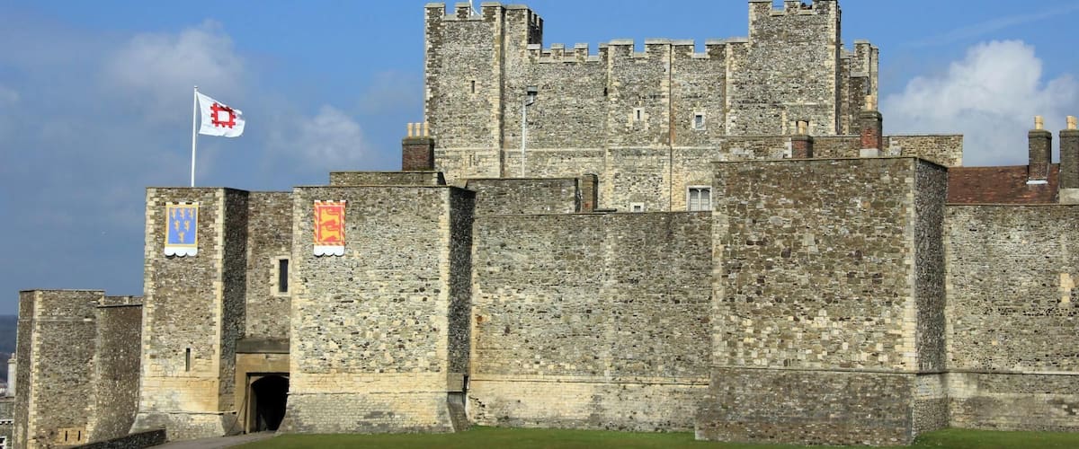 For a great family day out in Kent visit Dover Castle, open all year round. Immerse yourself in our dramatic new visitor experience, Operation Dynamo: Rescue from Dunkirk, open now to visitors. Spectacularly situated above the White Cliffs of Dover this magnificent castle has guarded our shores from invasion for 20 centuries - now you can enjoy a great family day out with a visit to the 'Key to England'. Explore the darkly atmospheric Secret Wartime Tunnels now with a vivid recreation of the Dunkirk evacuation, complete with dramatic projections of swooping Spitfires and real film footage. Watch Heart FM's breakfast team James & Charlie as they experience Operation Dynamo. Enjoy a colourful contrast with the richly-furnished Great Tower, where costumed actors introduce medieval life at King Henry II's court. With exciting exhibitions, winding tunnels to explore, ghosts to hunt out - and of course restaurants, shops and the space for youngsters to run around - an action-packed, great value day out awaits!