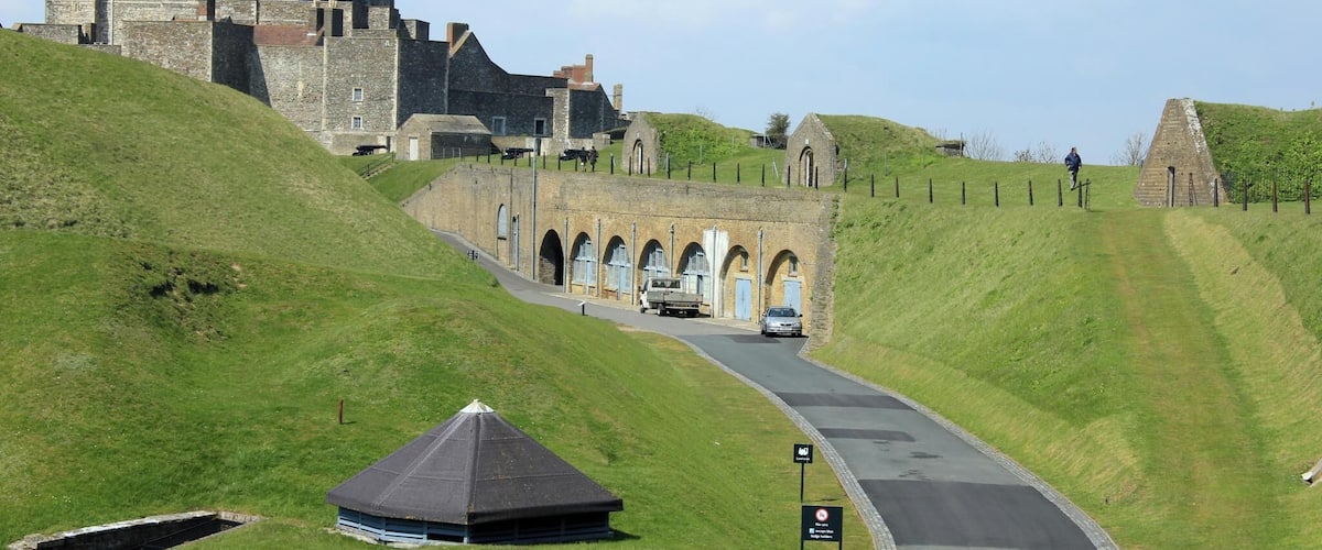 For a great family day out in Kent visit Dover Castle, open all year round. Immerse yourself in our dramatic new visitor experience, Operation Dynamo: Rescue from Dunkirk, open now to visitors. Spectacularly situated above the White Cliffs of Dover this magnificent castle has guarded our shores from invasion for 20 centuries - now you can enjoy a great family day out with a visit to the 'Key to England'. Explore the darkly atmospheric Secret Wartime Tunnels now with a vivid recreation of the Dunkirk evacuation, complete with dramatic projections of swooping Spitfires and real film footage. Watch Heart FM's breakfast team James & Charlie as they experience Operation Dynamo. Enjoy a colourful contrast with the richly-furnished Great Tower, where costumed actors introduce medieval life at King Henry II's court. With exciting exhibitions, winding tunnels to explore, ghosts to hunt out - and of course restaurants, shops and the space for youngsters to run around - an action-packed, great value day out awaits!
