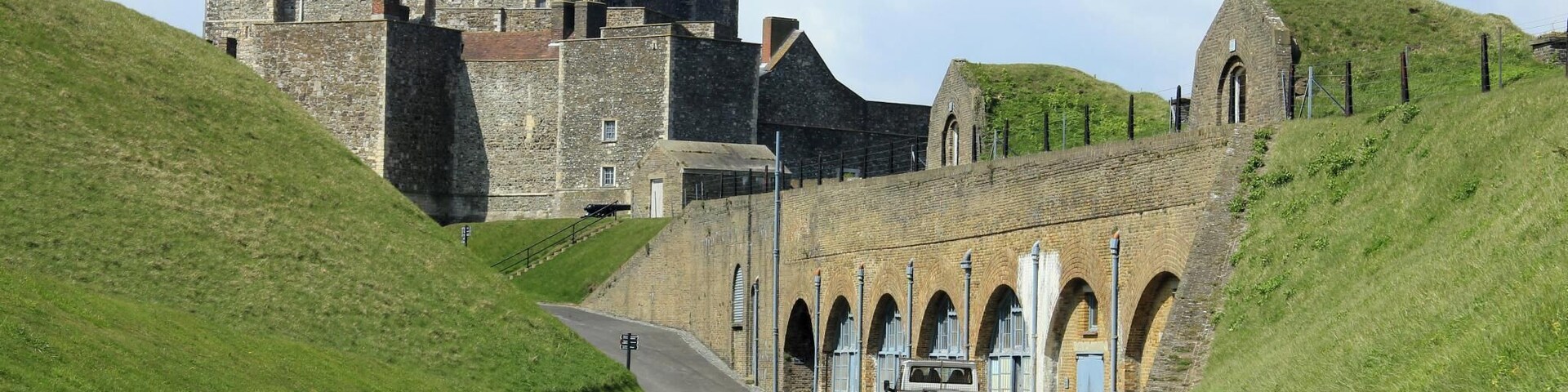For a great family day out in Kent visit Dover Castle, open all year round. Immerse yourself in our dramatic new visitor experience, Operation Dynamo: Rescue from Dunkirk, open now to visitors. Spectacularly situated above the White Cliffs of Dover this magnificent castle has guarded our shores from invasion for 20 centuries - now you can enjoy a great family day out with a visit to the 'Key to England'. Explore the darkly atmospheric Secret Wartime Tunnels now with a vivid recreation of the Dunkirk evacuation, complete with dramatic projections of swooping Spitfires and real film footage. Watch Heart FM's breakfast team James & Charlie as they experience Operation Dynamo. Enjoy a colourful contrast with the richly-furnished Great Tower, where costumed actors introduce medieval life at King Henry II's court. With exciting exhibitions, winding tunnels to explore, ghosts to hunt out - and of course restaurants, shops and the space for youngsters to run around - an action-packed, great value day out awaits!
