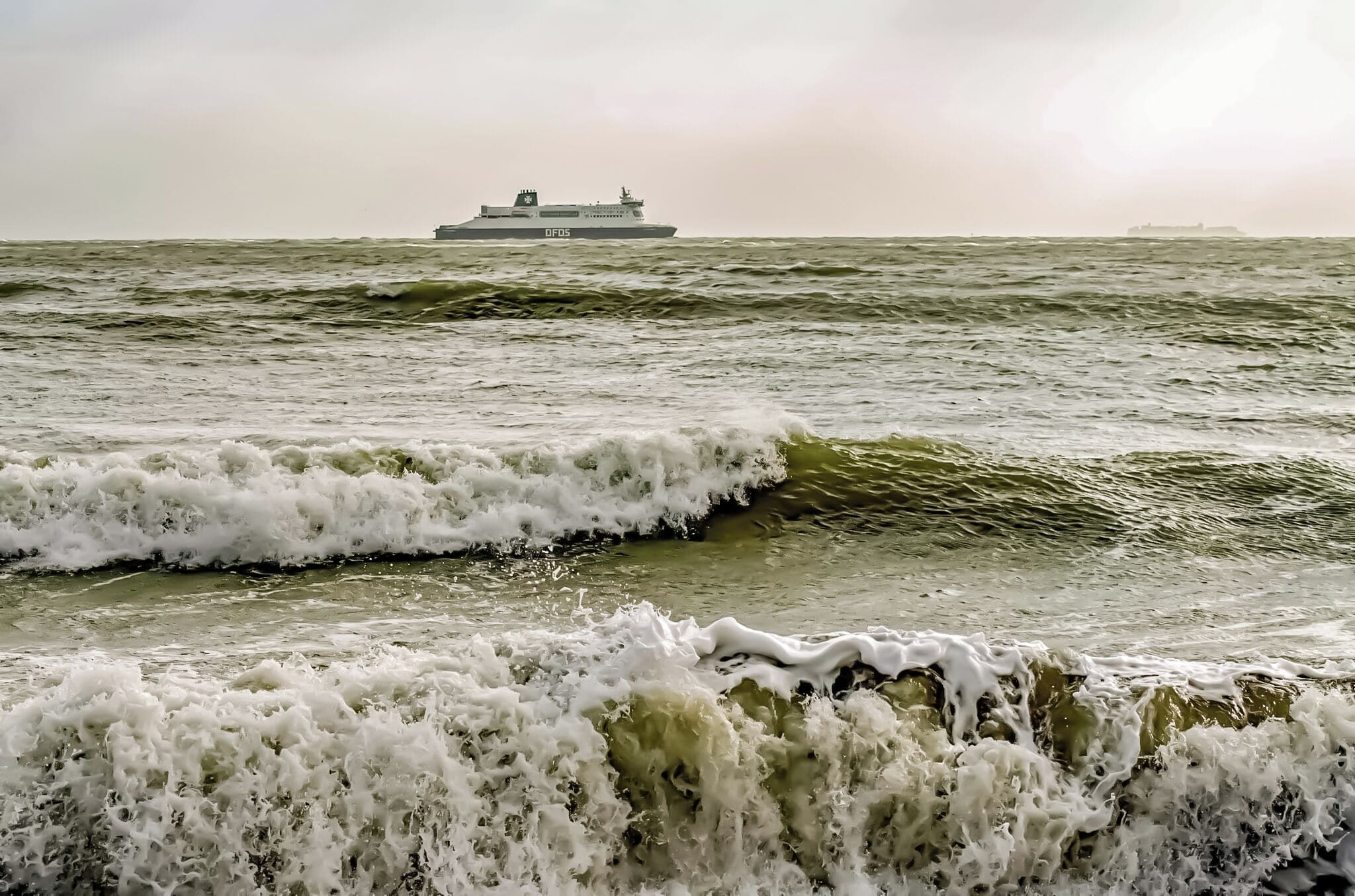Ferry from Calais to Dover fighting strong winds and rough sea.