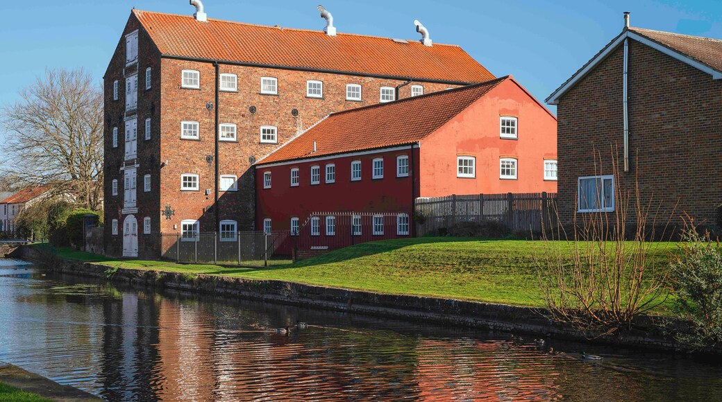 Rear view of ancient, now converted warehouses, and canal head. Driffield, UK.