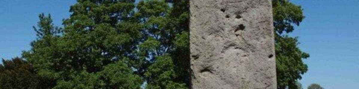Rudston monolith, Rudston, East Riding of Yorkshire, England. In the Church (All Saints) Yard Rudston. Approximately 8m above ground it is Britain's tallest standing stone. It's weight is estimated at 40 tonnes. In the late 18th century tests revealed that there is as much again of the stone buried in the ground. dating from 2000 BC the stone is believed to come from near Whitby.