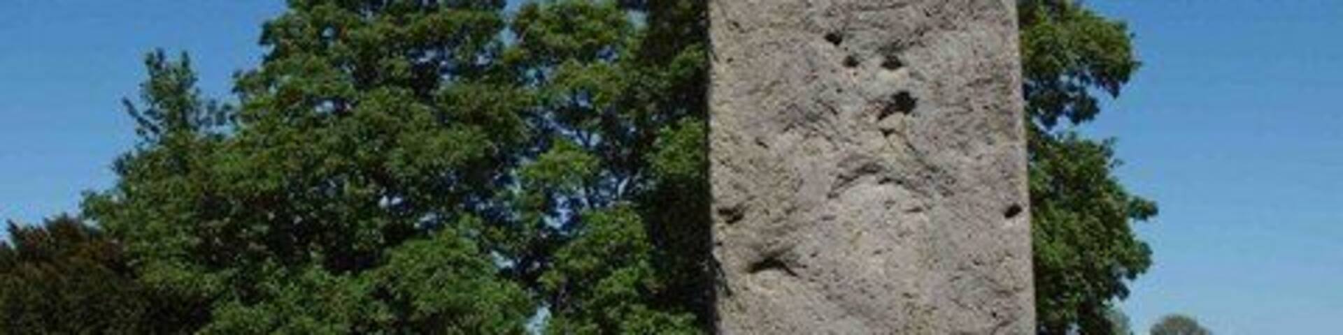 Rudston monolith, Rudston, East Riding of Yorkshire, England. In the Church (All Saints) Yard Rudston. Approximately 8m above ground it is Britain's tallest standing stone. It's weight is estimated at 40 tonnes. In the late 18th century tests revealed that there is as much again of the stone buried in the ground. dating from 2000 BC the stone is believed to come from near Whitby.