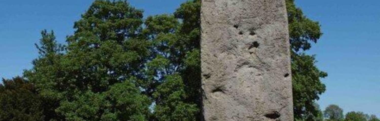 Rudston monolith, Rudston, East Riding of Yorkshire, England. In the Church (All Saints) Yard Rudston. Approximately 8m above ground it is Britain's tallest standing stone. It's weight is estimated at 40 tonnes. In the late 18th century tests revealed that there is as much again of the stone buried in the ground. dating from 2000 BC the stone is believed to come from near Whitby.